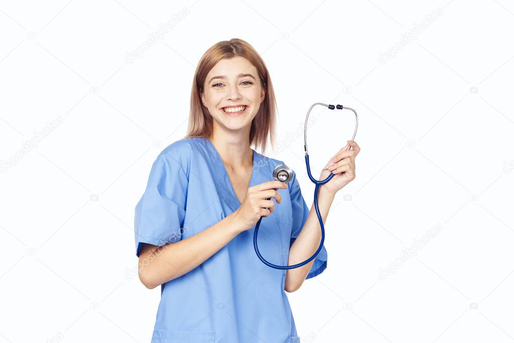 young beautiful nurse with stethoscope isolated on white
