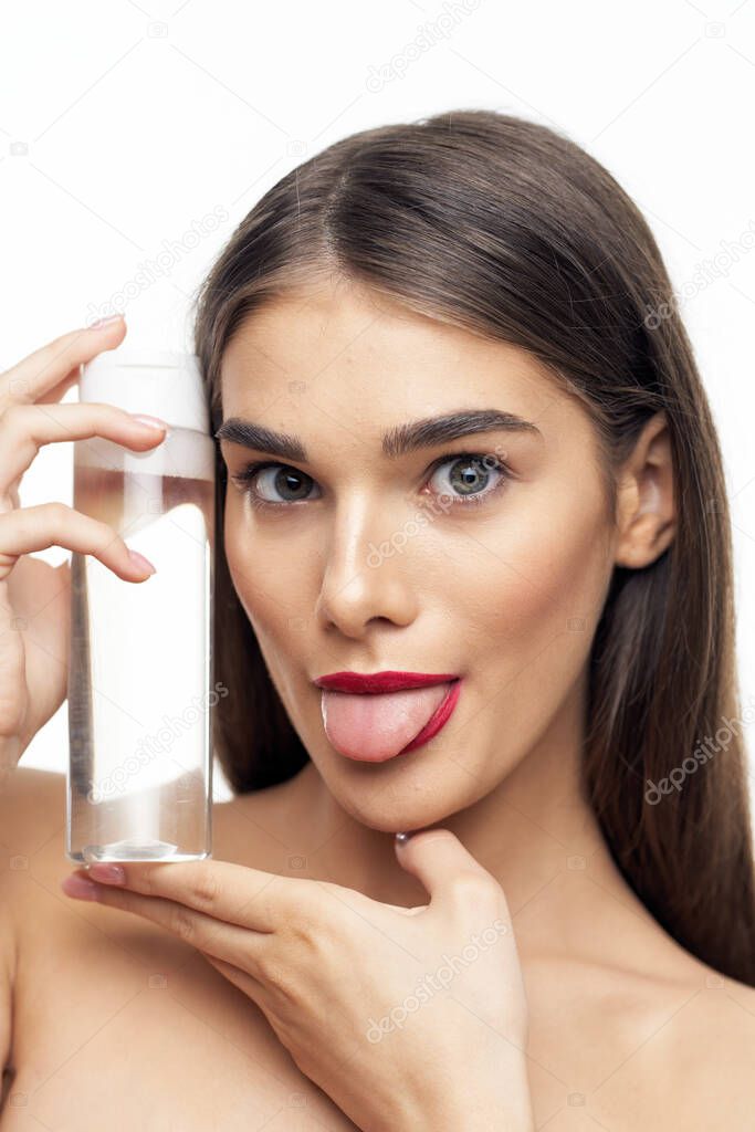  beautiful woman holding beauty product on  isolated   background