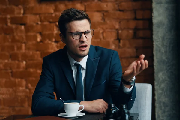 Young  businessman with coffee  in the office