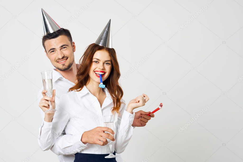 portrait of young beautiful couple celebrating birthday  with champagne