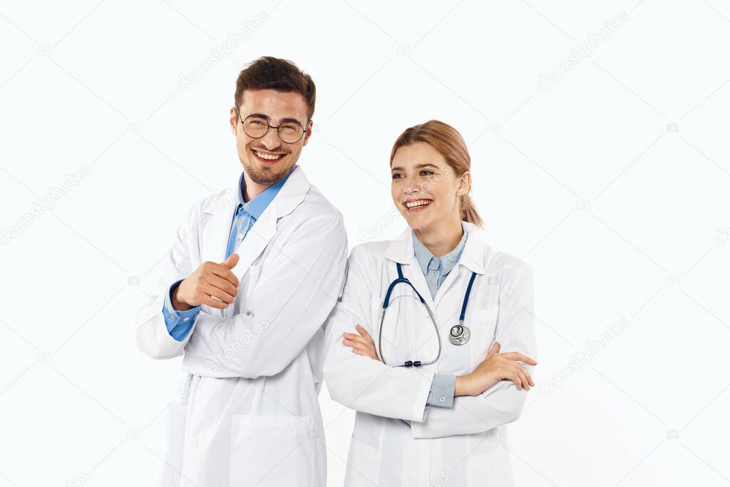 Young therapists smiling   isolated on white background. 