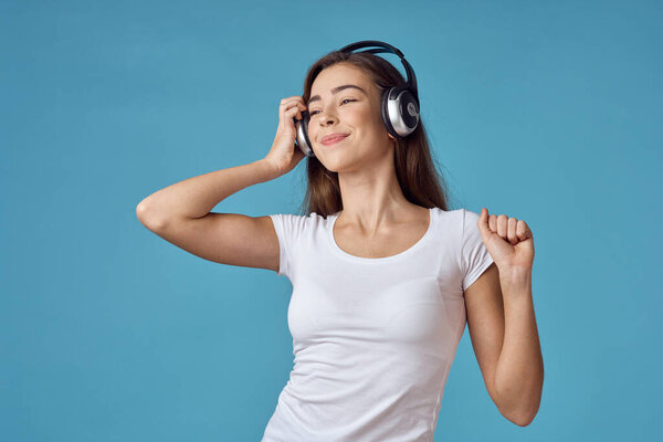 Young beautiful woman with headphones in studio