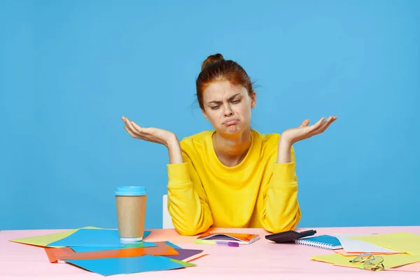 Young woman designer sitting at desk