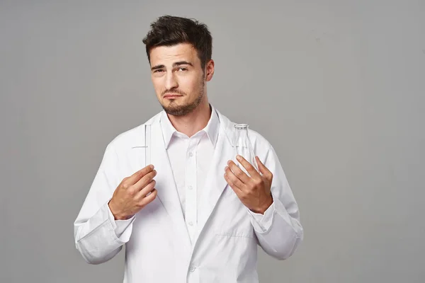 Young Handsome Doctor Lab Coat Test Tubes Grey Background — Stock Photo, Image