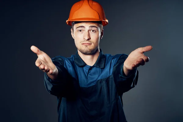 young worker in hardhat posing