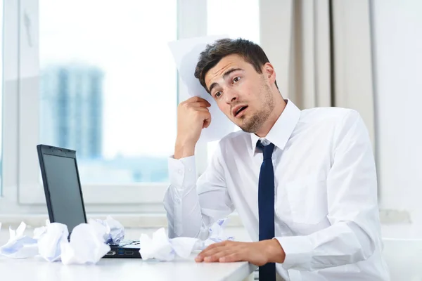 Young confused  businessman in the office