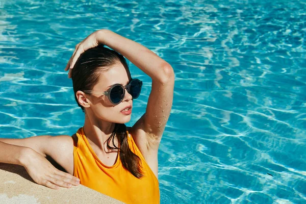 stock image Young beautiful woman relaxing in the pool  