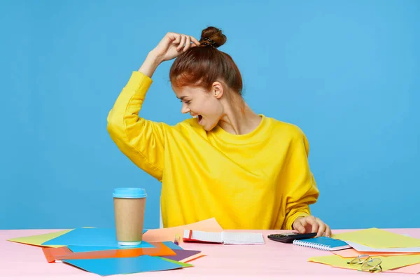 Young woman designer sitting at desk