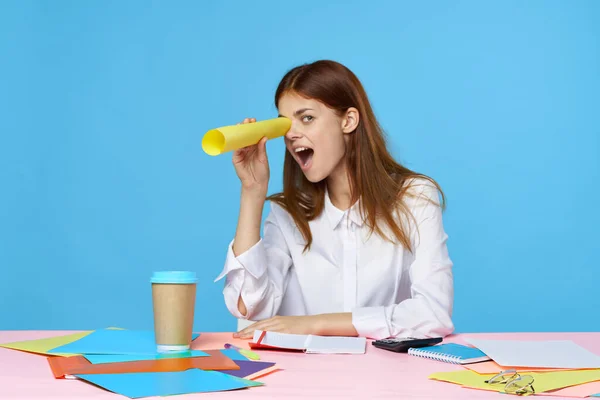 Young woman designer sitting at desk