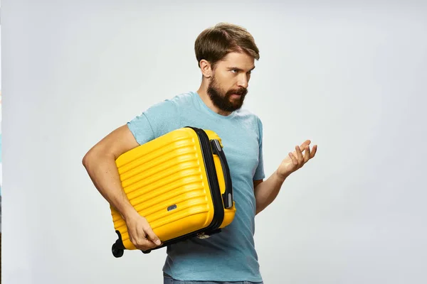 Bearded man yellow suitcase on vacation — Stock Photo, Image