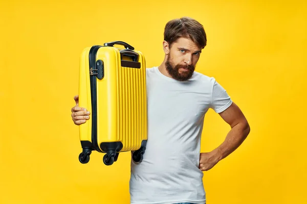 Man with yellow suitcase vacation travel passenger — Stock Photo, Image