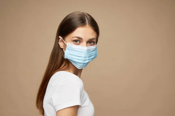 Pretty woman fashion clothes in a face mask health hazard