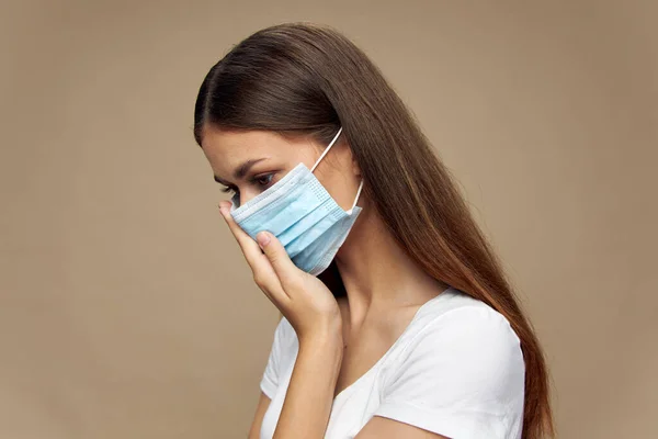 Young woman   in a protective mask health hazard front view