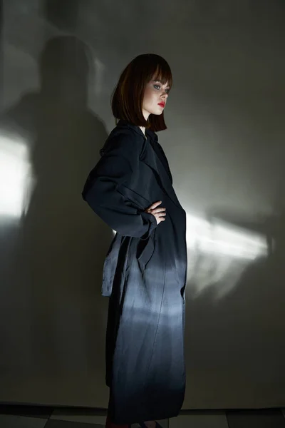 Dark background adult model coat isolated background