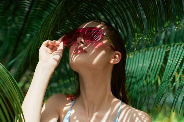 Woman glasses swimsuit summer exotic palms — Stock Photo, Image