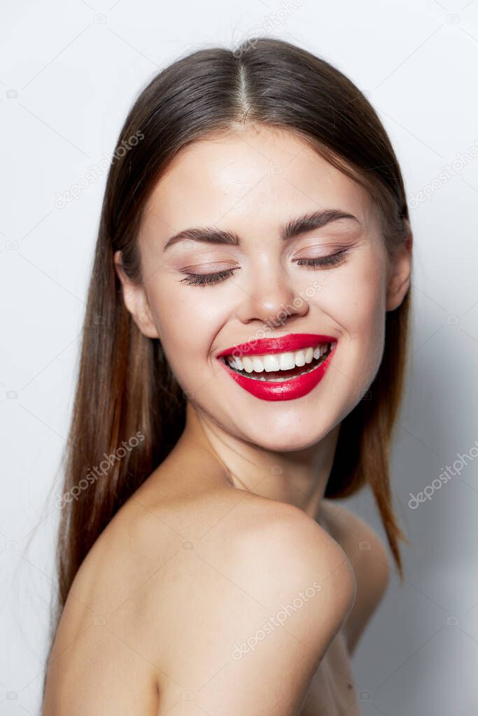 Attractive woman Bare shoulders smile closed eyes natural look 