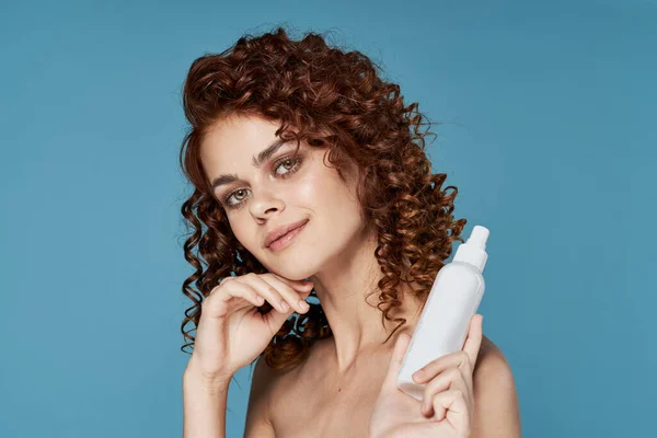 Young beautiful woman with beauty product. studio shot