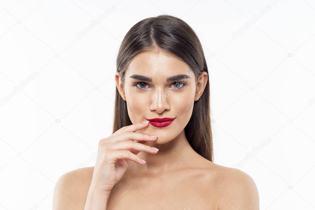 Studio shot. Young beautiful woman looking at camera on  white  background 