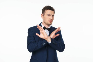 Young   man  with stop gesture  in studio,  isolated  background