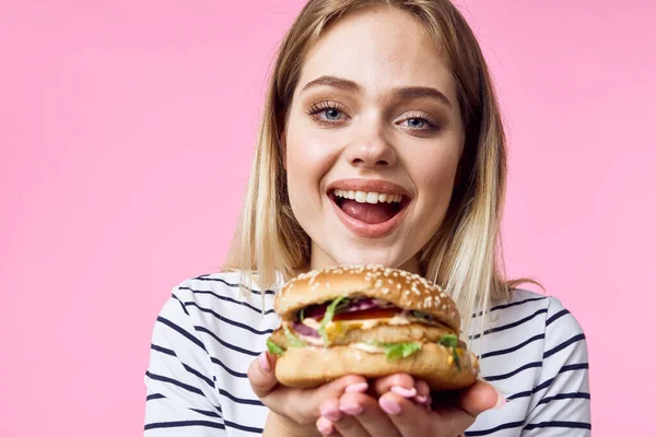 beautiful happy woman  with  hamburger on isolated background