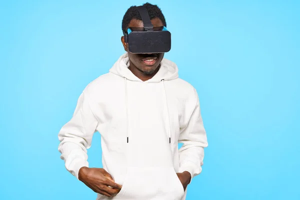 young man wearing vr glasses in studio