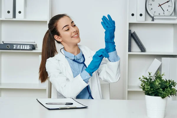 Young Doctor Putting Gloves Desk Hospital — Stock Photo, Image