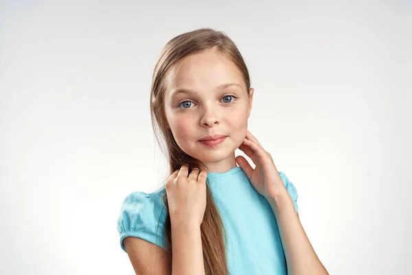 Cute girl blue dresses cropped view light background emotions childhood fun — Stock Photo, Image