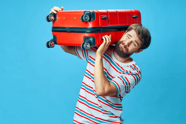 Man with heavy luggage on his shoulders travel vacation tourism airport — Stock Photo, Image