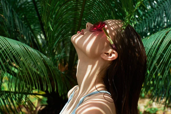 Woman in swimsuit Exotic tropics pure skin cosmetics — Stock Photo, Image