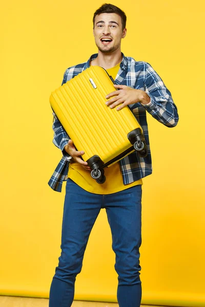Man with yellow suitcase tourism travel passenger yellow isolated background