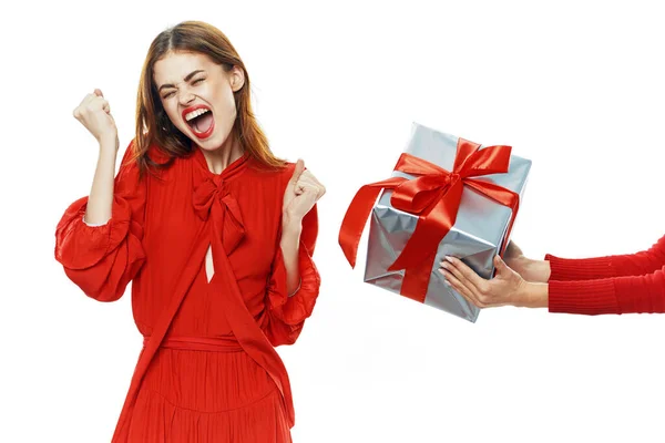 Woman in red dress gift fun surprise — Stock Photo, Image