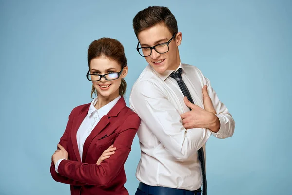 business man and woman office officials communication work colleagues studio blue background