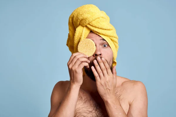 stock image a man with a yellow towel on his head bum bare shoulders clean skin taking a shower