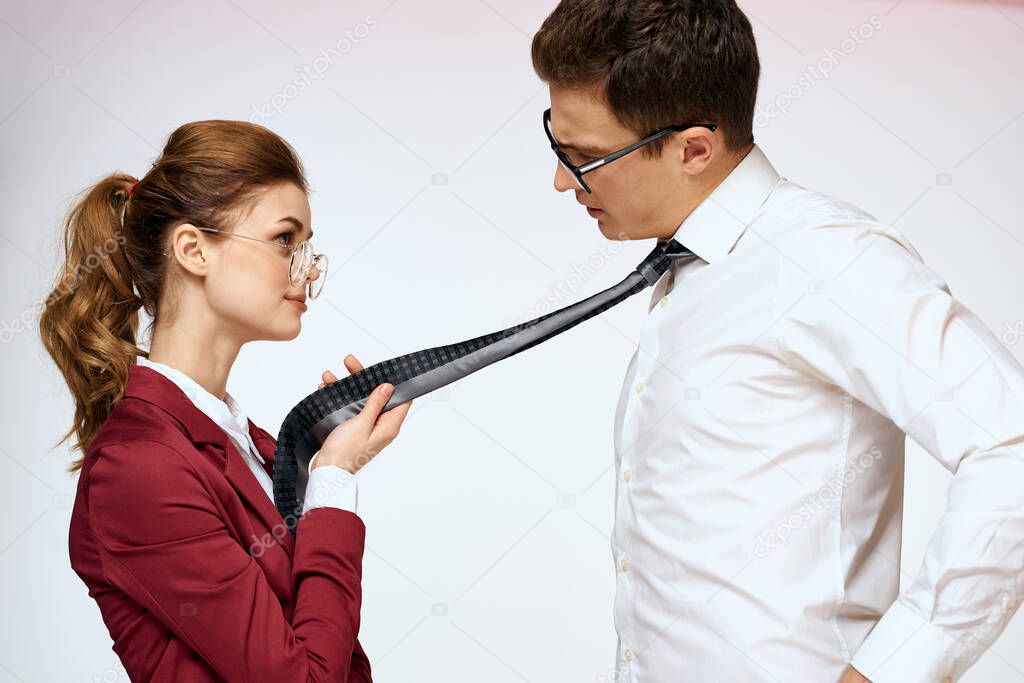 man and woman work colleagues officials communication light background