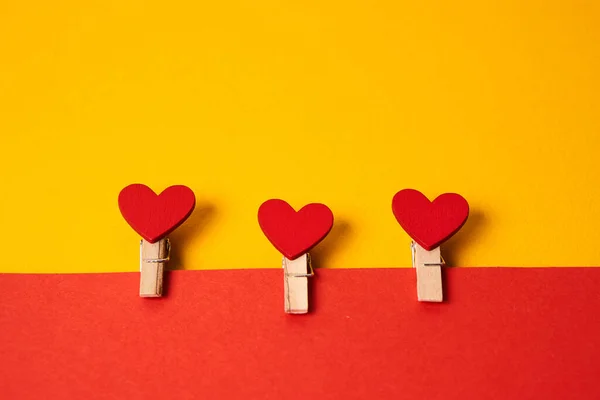 Hearts on a clothespin two-color background Copy Space free space — Stock fotografie