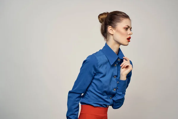 woman model in blue shirt and red skirt glasses beautiful face makeup studio