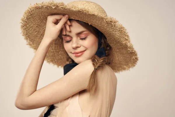 Romantic woman in a hat and dress on a light background gestures with her hands portrait fun emotions cropped view — Stock Photo, Image