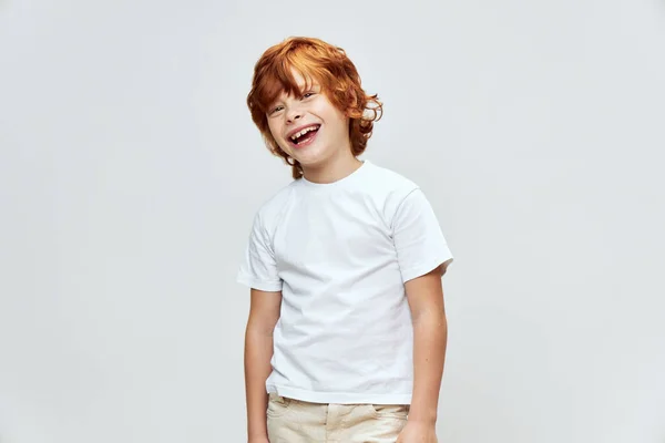 Joyful child white t-shirt wide open smile cropped view white t-shirt studio — Stock Photo, Image