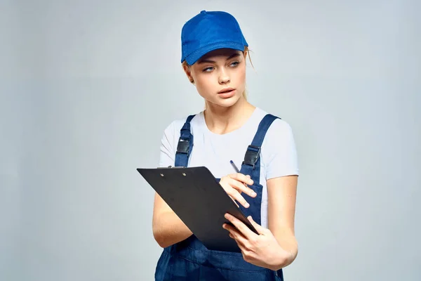 Woman courier in uniform documents service delivery — Stock Photo, Image