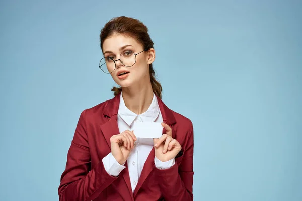 Business woman red jacket business card glasses executive blue background — Stock Photo, Image