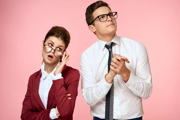 Business man and woman office work colleagues team office management studio pink background — Stock Photo, Image