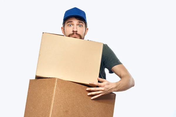 Working man with boxes in hands delivery service work lifestyle — Stock Photo, Image