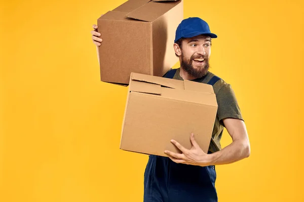 working man with box in hands delivery loading transportation service
