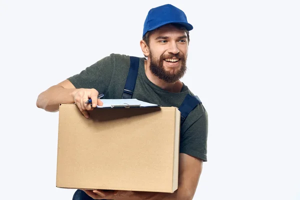 Mann in Arbeitsuniform Box Delivery Lader Kurier Licht Hintergrund — Stockfoto