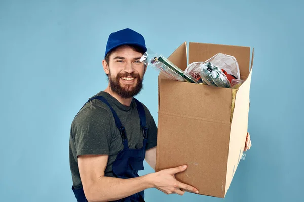 working man boxes in hands delivery service packaging lifestyle blue background