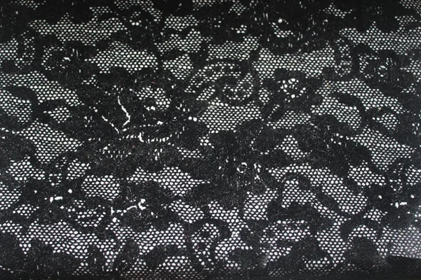 Kumaş yapısı. Ağdaki bir gül siyah desenli kumaş kadar yakın bir doku. Dekor ya da arka plan duvar kağıdı ve web tasarım için kullanmak.