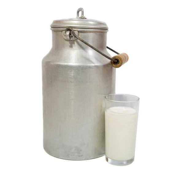 Glass of fresh milk and milk canister — Stock Photo, Image