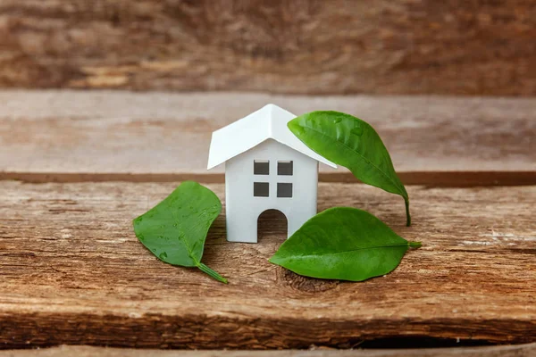 Miniature White Toy Model House Green Leaves Wooden Backgdrop Eco — Stock Photo, Image