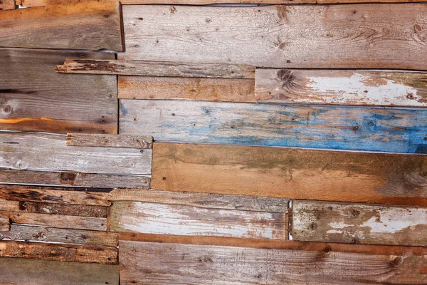 Simple eco wooden desk texture. Close up of wall made of brown and blue wooden planks