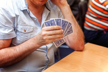 close up view of cards in hands clipart